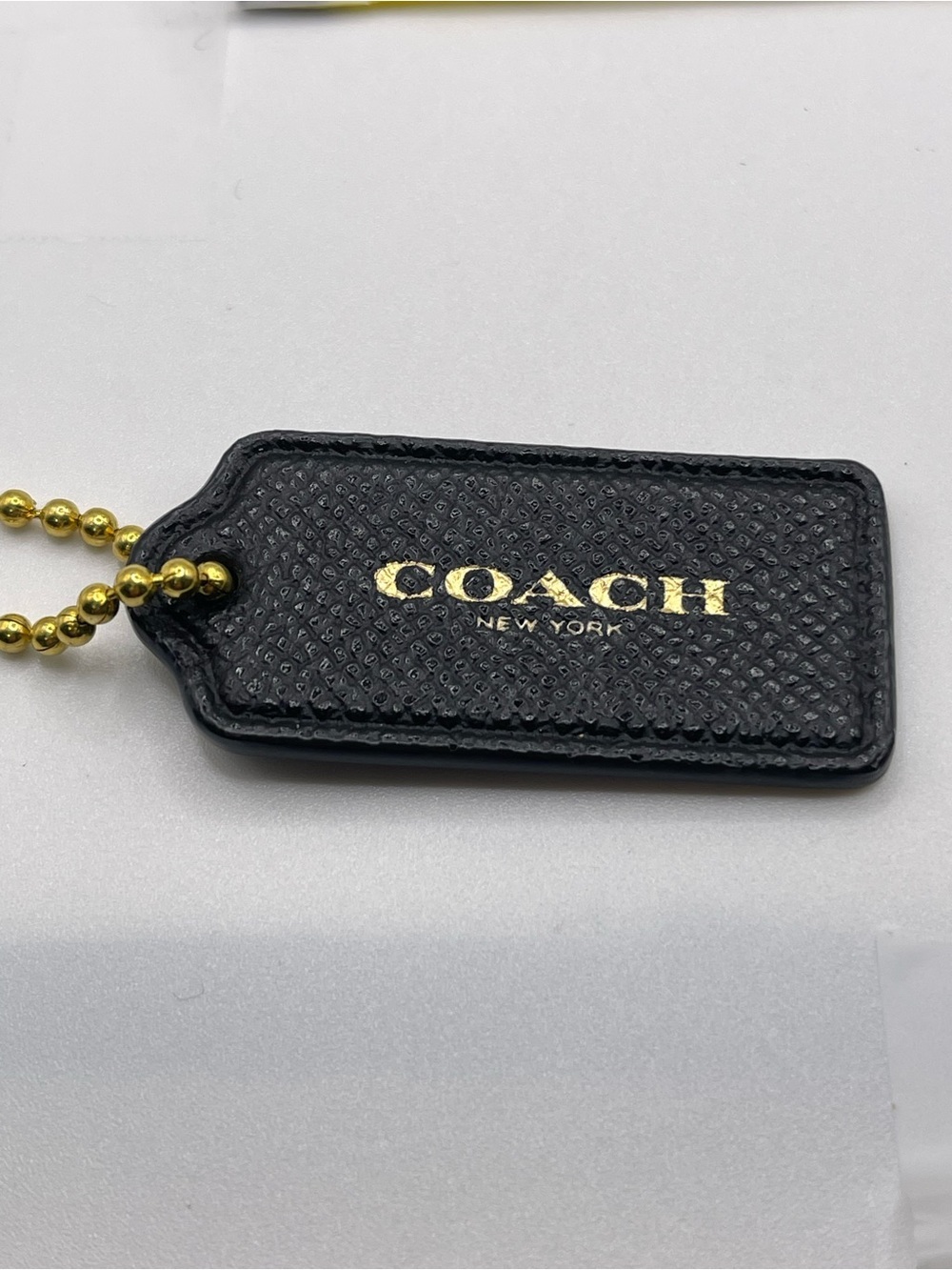 Coach Black Leather Hang Tag with Gold Logo